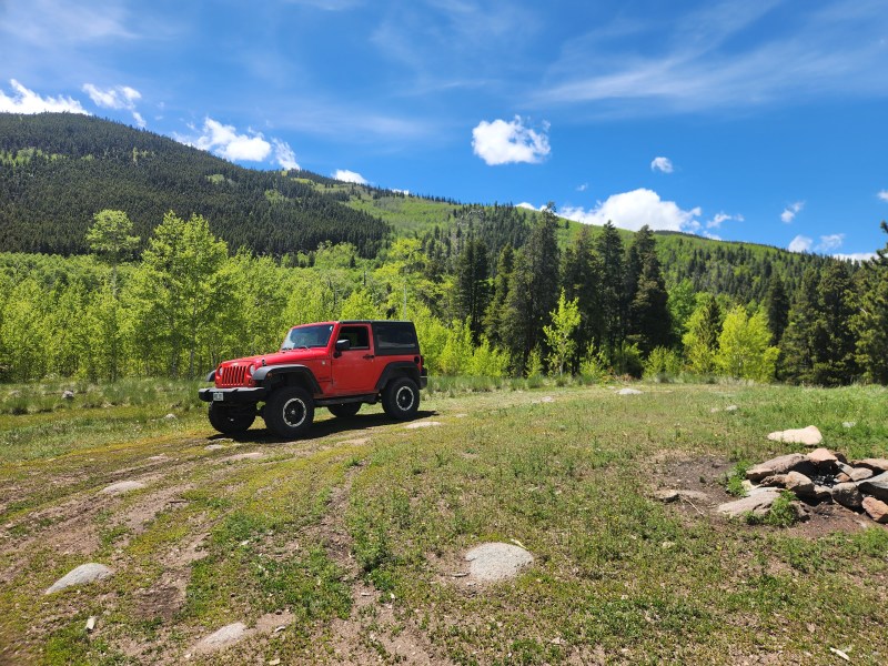 Jeep parked in a Colorado mountain meadow